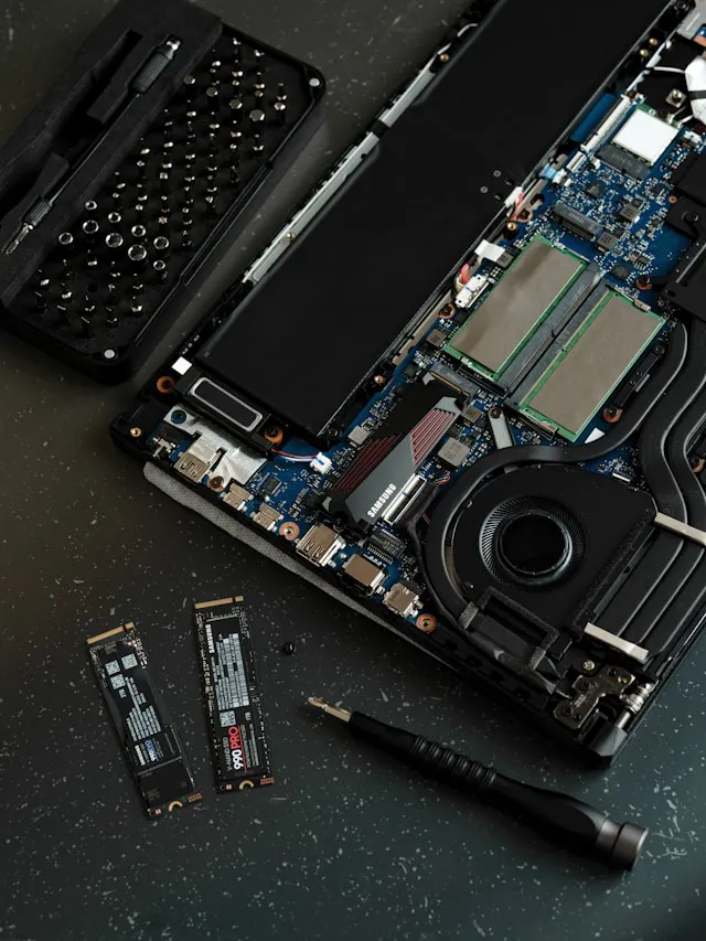 Home 1 A computer repair technician in San Jose performing a high-speed SSD upgrade on a professional workstation for a local business client.